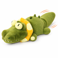 Wiggle crocodile dog toy, green plush crocodile with yellow float ring and wagging tail, on white background