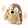 Bouncy hedgehog dog toy, plush hedgehog with googly eyes that wiggles and bounces, on white background